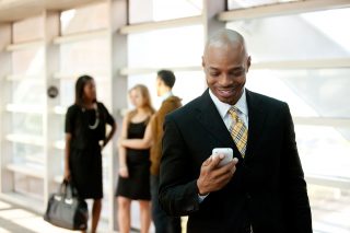 bigstock-Business-Man-With-Smart-Phone